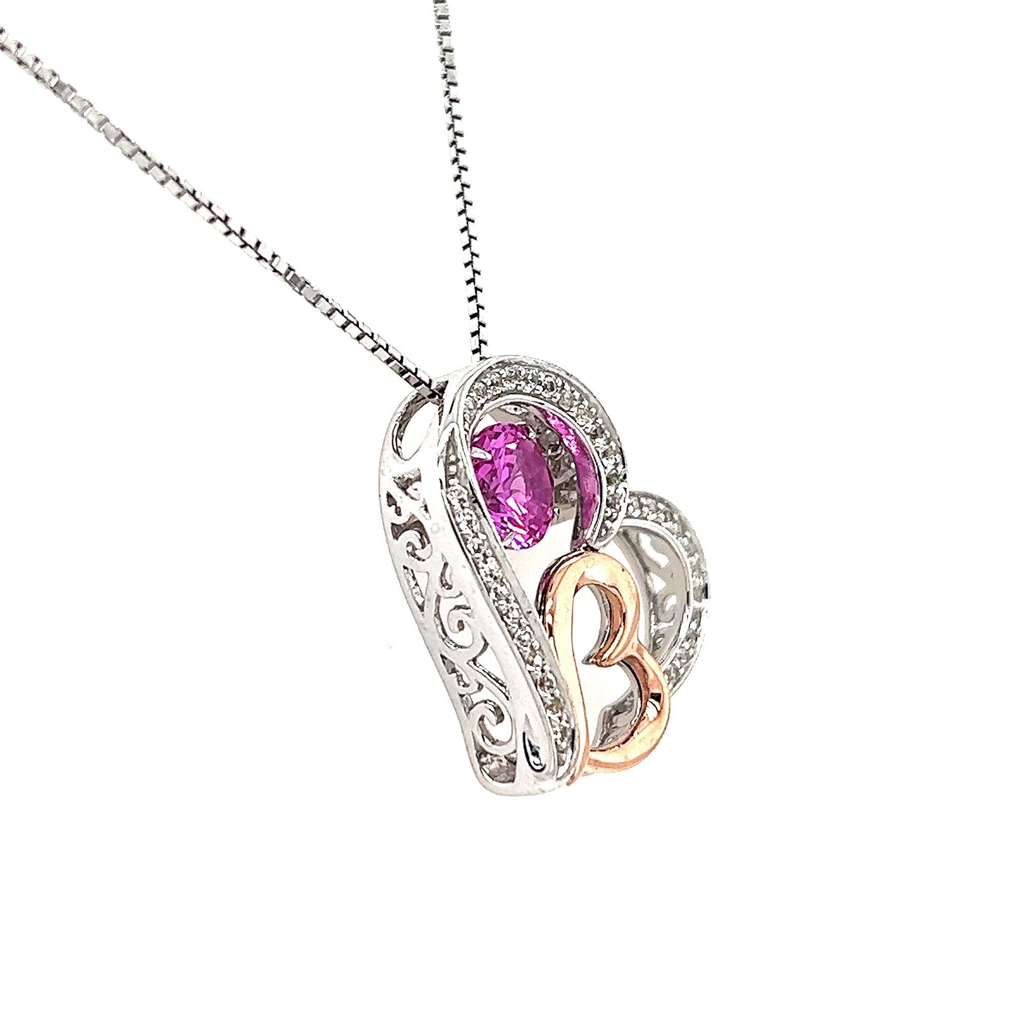 Rocking Stone Collection- 10KT Yellow Gold And Silver 2 Heart Shaped Pendant With Rocking Created Pink Sapphire And White Sapphire Detail